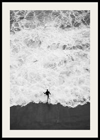 Black and white photo of person running towards wavy sea-2