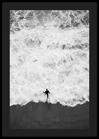 Black and white photo of person running towards wavy sea-4