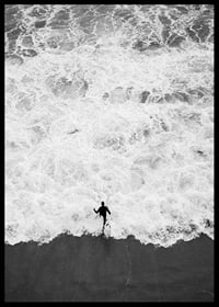 Black and white photo of person running towards wavy sea-6
