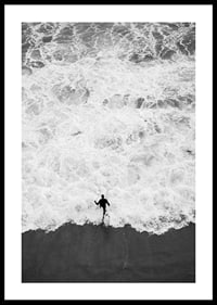 Black and white photo of person running towards wavy sea-0
