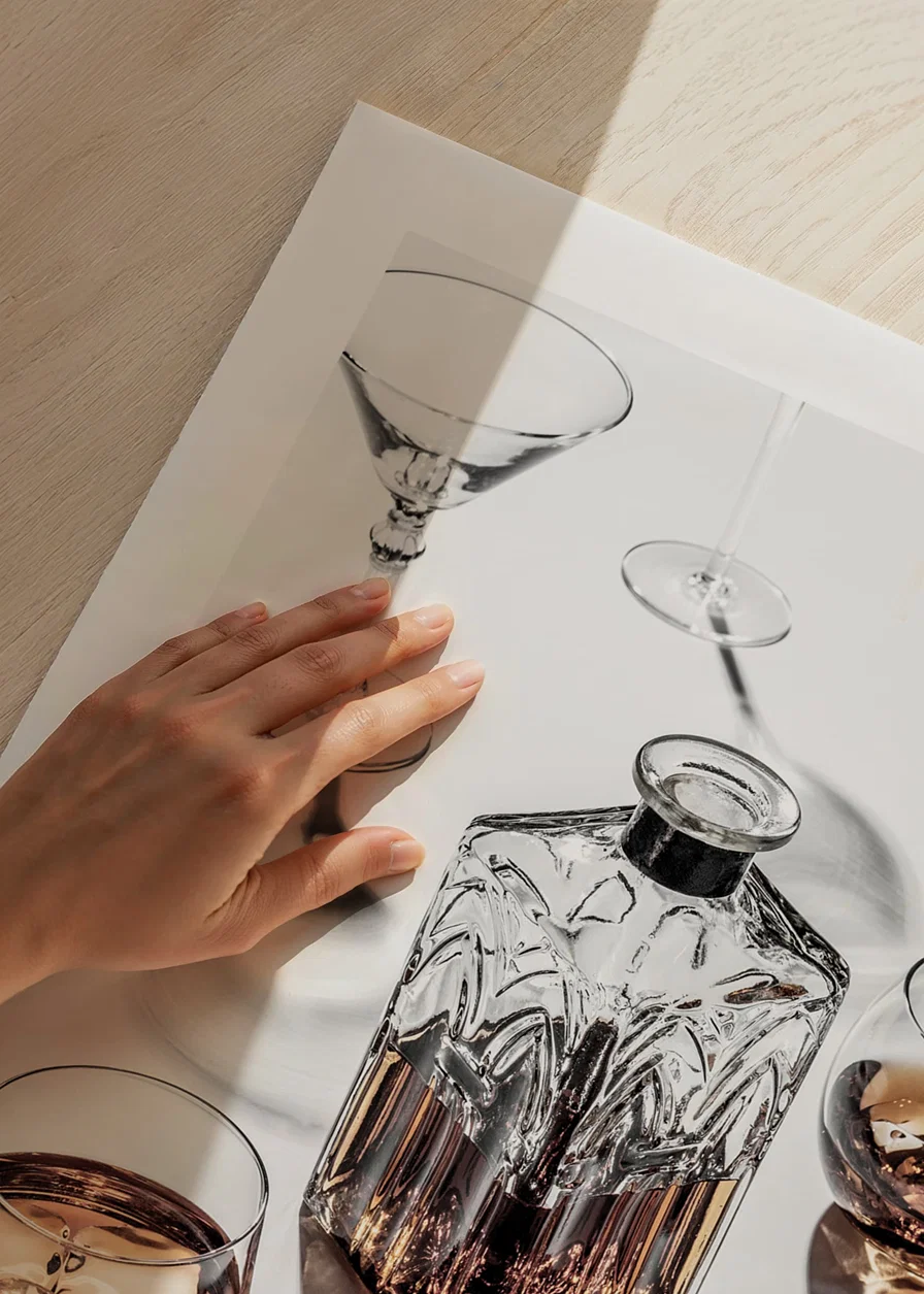 Photograph of whiskey decanter and glass with ice on light surface-12