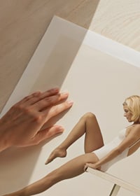 Photograph of woman in white swimsuit balancing on edge-9