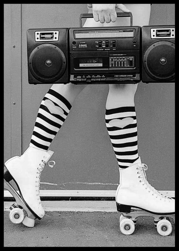 Black and white photo of legs in roller skates and striped socks-12