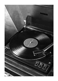 Black and white close-up of classic vinyl player with record-3