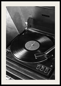 Black and white close-up of classic vinyl player with record-4
