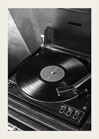 Black and white close-up of classic vinyl player with record-5
