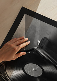 Black and white close-up of classic vinyl player with record-9