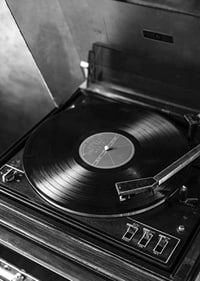 Black and white close-up of classic vinyl player with record-7