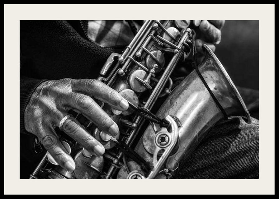 Black and white photo of hands playing a saxophone-12