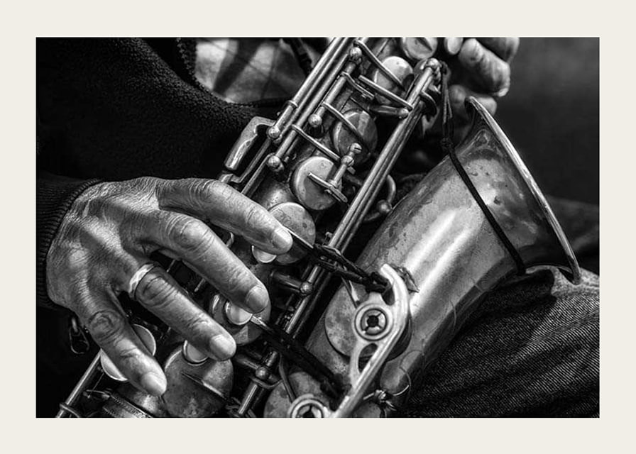 Black and white photo of hands playing a saxophone-12