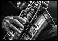 Black and white photo of hands playing a saxophone-6
