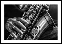 Black and white photo of hands playing a saxophone-0