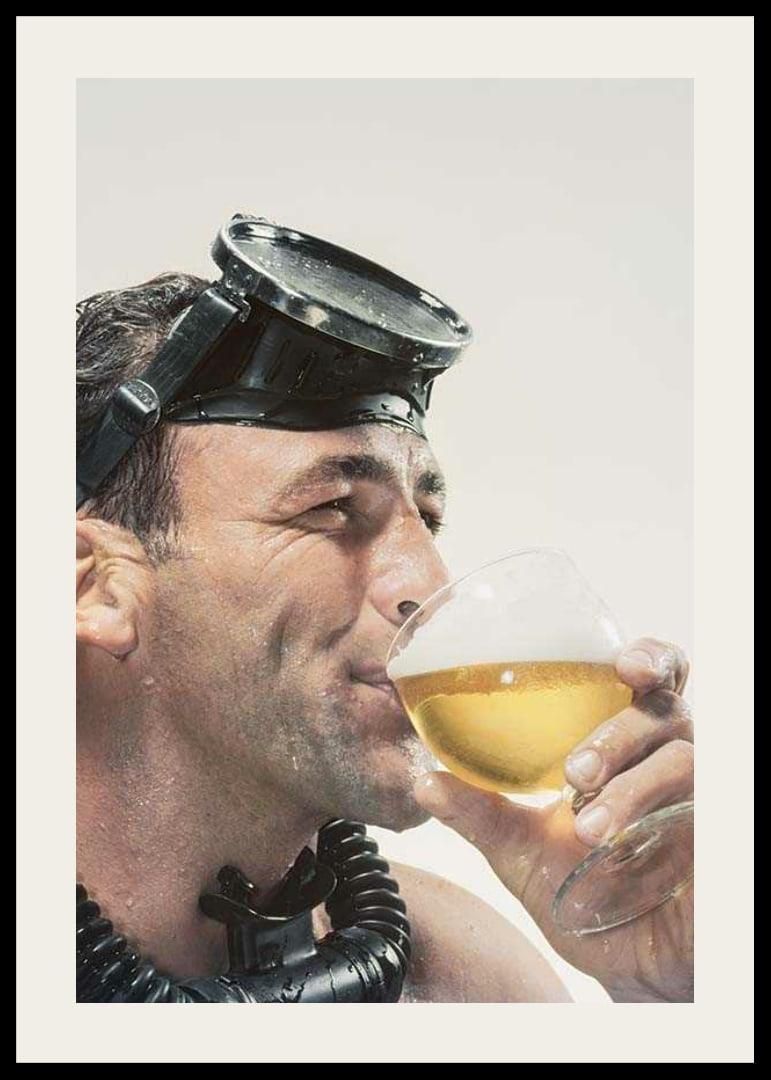 Photograph of man with cyclops and snorkel drinking beer-12