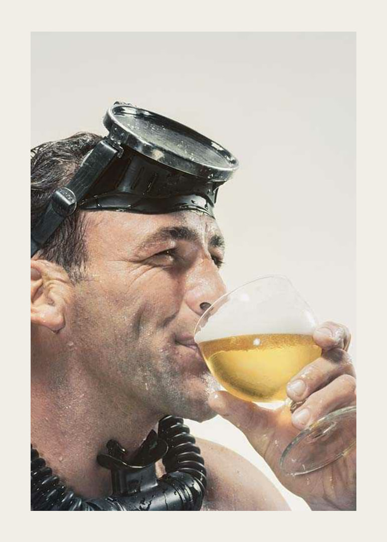 Photograph of man with cyclops and snorkel drinking beer-12
