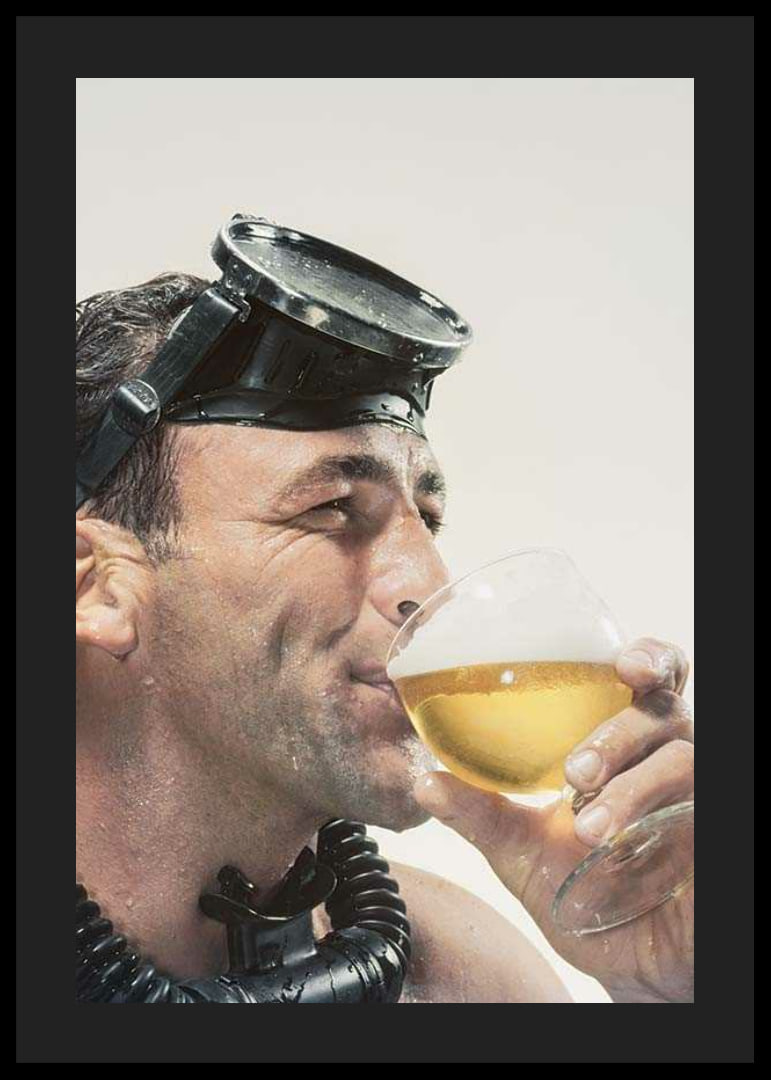 Photograph of man with cyclops and snorkel drinking beer-12