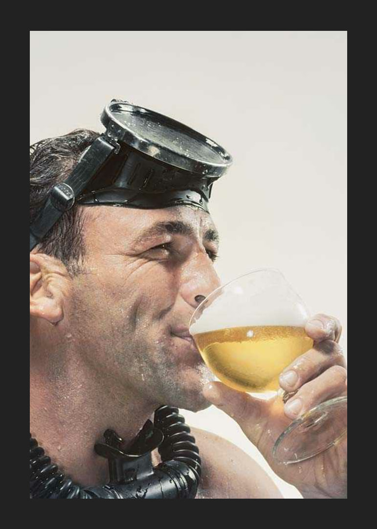 Photograph of man with cyclops and snorkel drinking beer-12