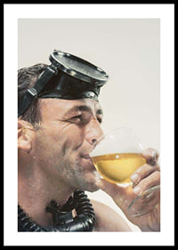 Photograph of man with cyclops and snorkel drinking beer-0