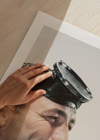Photograph of man with cyclops and snorkel drinking beer-9