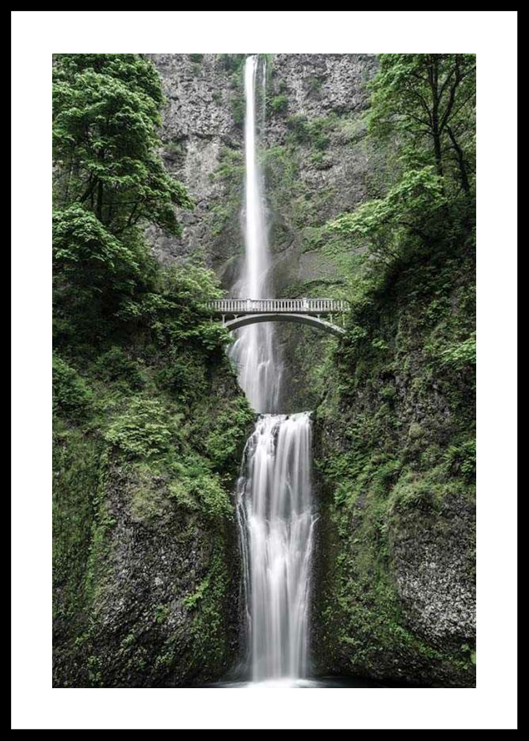 High waterfall with stone bridge, surrounded by greenery, photographic-12