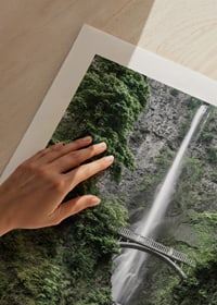 High waterfall with stone bridge, surrounded by greenery, photographic-9