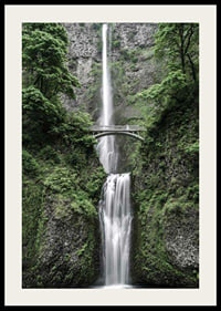 High waterfall with stone bridge, surrounded by greenery, photographic-2