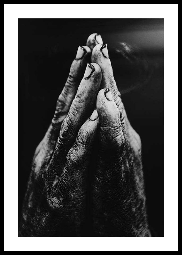 Black and white close-up of worn, dirty hands in prayer position-12