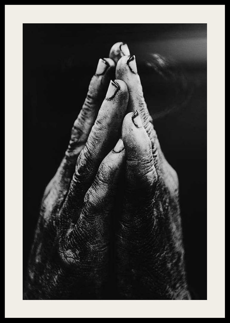 Black and white close-up of worn, dirty hands in prayer position-12