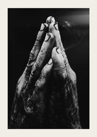 Black and white close-up of worn, dirty hands in prayer position-5