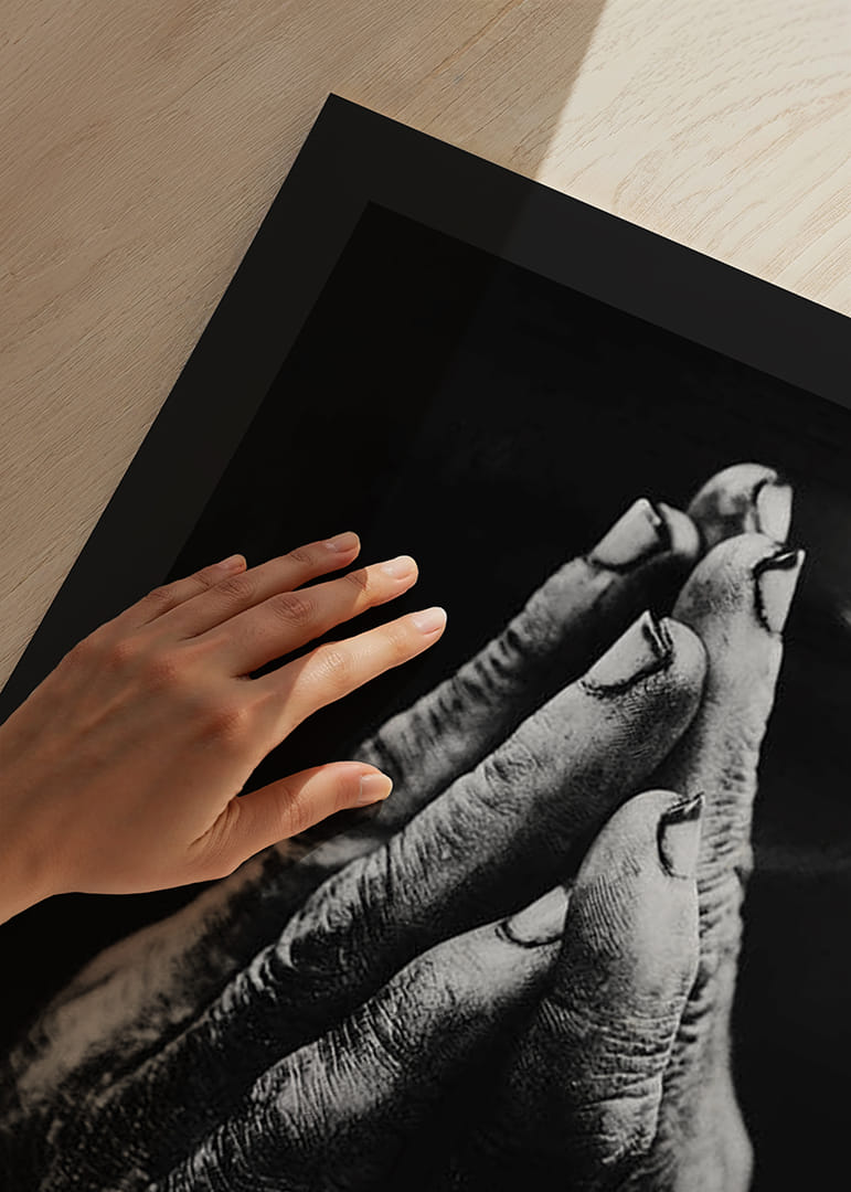 Black and white close-up of worn, dirty hands in prayer position-12