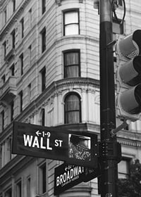 Black and white photographed road sign with text Wall Street-7