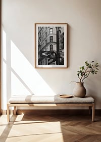 Black and white photographed road sign with text Wall Street-8