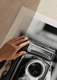 Black and white close-up of vintage two-lens analog camera on table-9