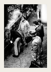 Black and white photo of men by steam locomotive on railway platform-3