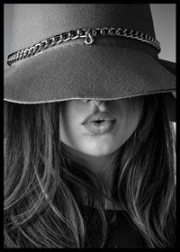 Black and white fashion image of woman with big hat and long hair-6
