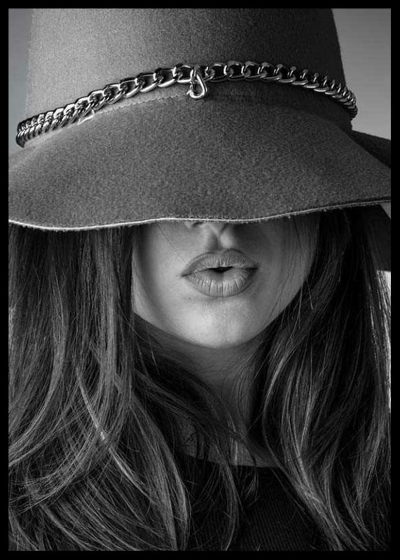 Black and white fashion image of woman with big hat and long hair-12