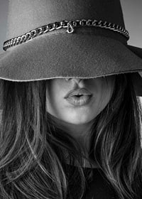 Black and white fashion image of woman with big hat and long hair-7