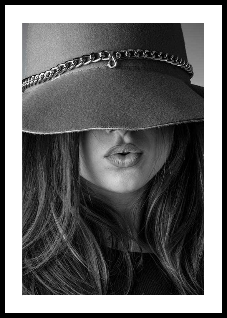 Black and white fashion image of woman with big hat and long hair-12