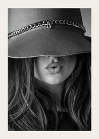 Black and white fashion image of woman with big hat and long hair-3
