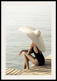 Photograph of woman in black swimsuit with large bright hat-2