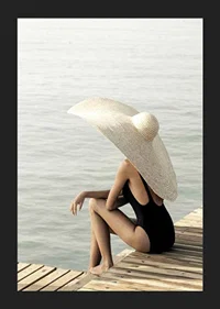 Photograph of woman in black swimsuit with large bright hat-5
