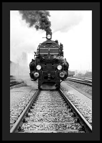 Black and white photograph of steam locomotive running straight towards the camera-4