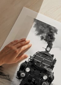 Black and white photograph of steam locomotive running straight towards the camera-9