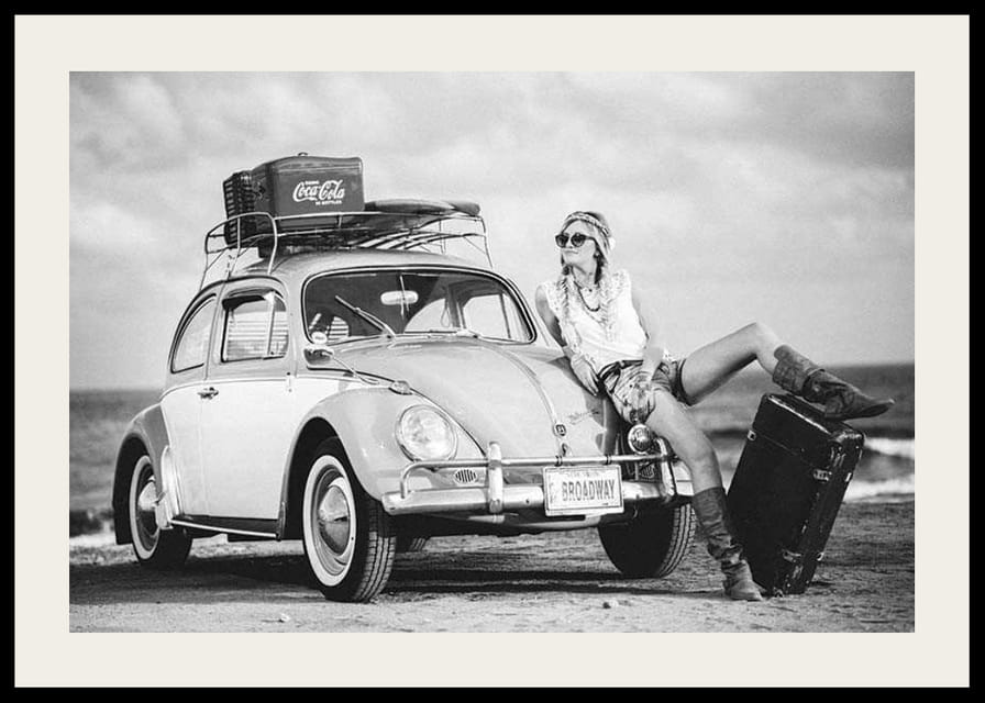 Black and white vintage photograph of woman by Volkswagen Beetle-12