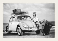 Black and white vintage photograph of woman by Volkswagen Beetle-3
