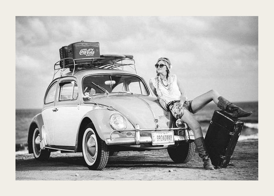 Black and white vintage photograph of woman by Volkswagen Beetle-12