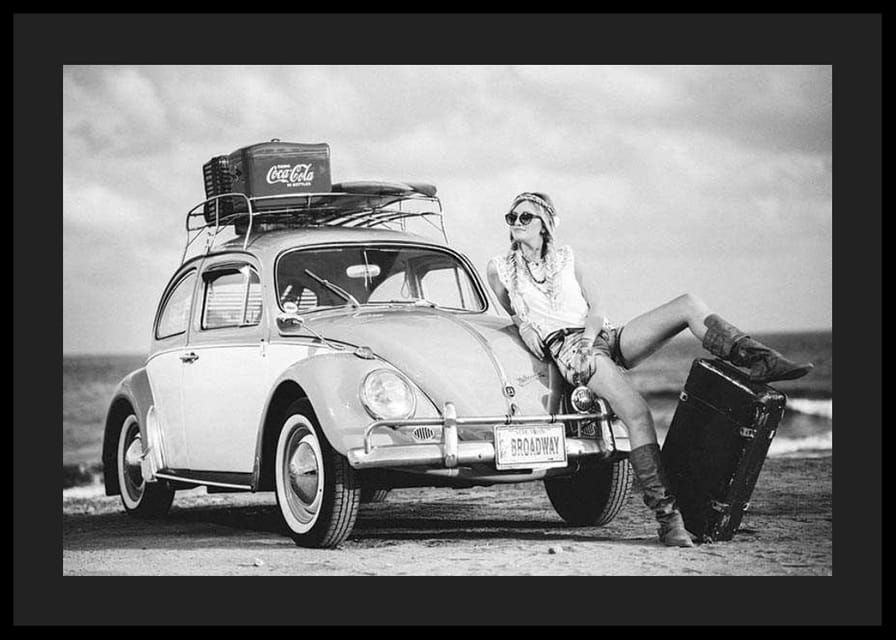 Black and white vintage photograph of woman by Volkswagen Beetle-12