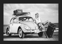 Black and white vintage photograph of woman by Volkswagen Beetle-5