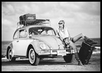Black and white vintage photograph of woman by Volkswagen Beetle-6