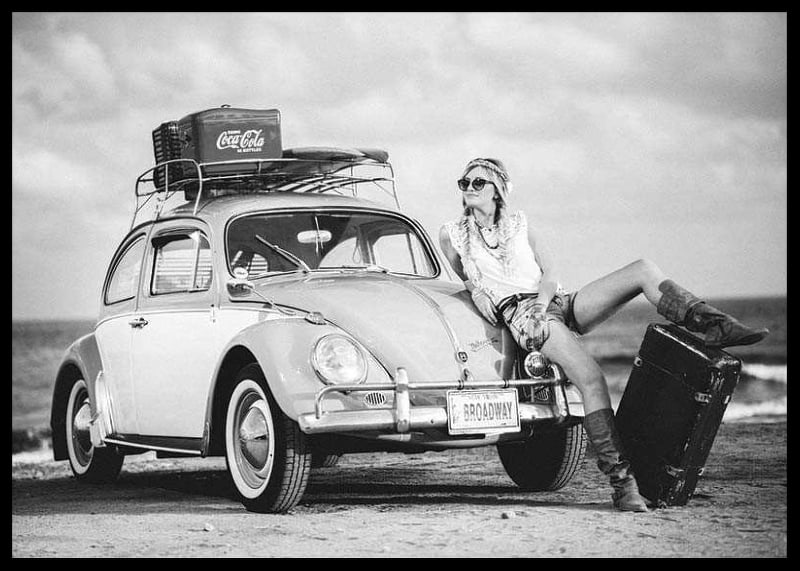 Black and white vintage photograph of woman by Volkswagen Beetle-12