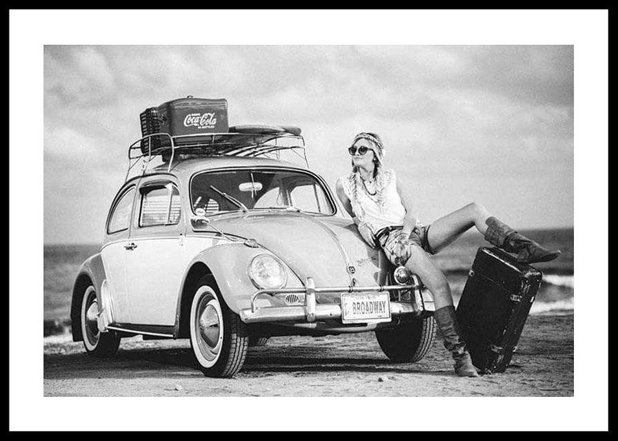 Black and white vintage photograph of woman by Volkswagen Beetle-12